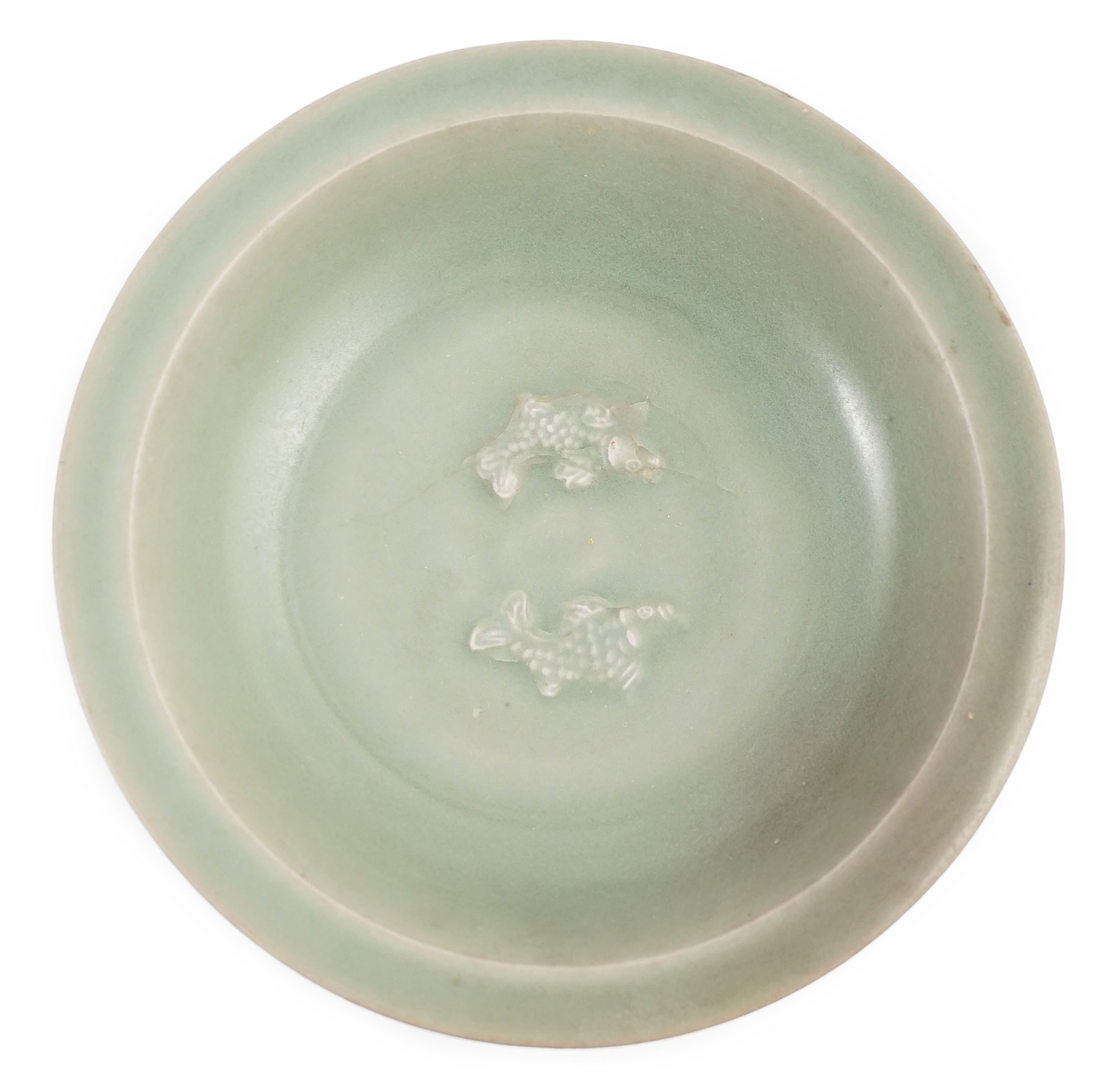 A Chinese Longquan celadon ‘twin fish’ marriage dish, Southern Song - Yuan dynasty, 13th/14th century, 22cm diameter, cracks to base